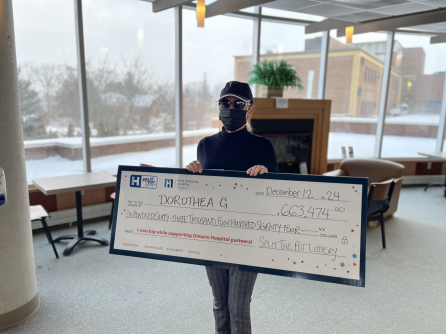 Dorothea G with big cheque.5 content images